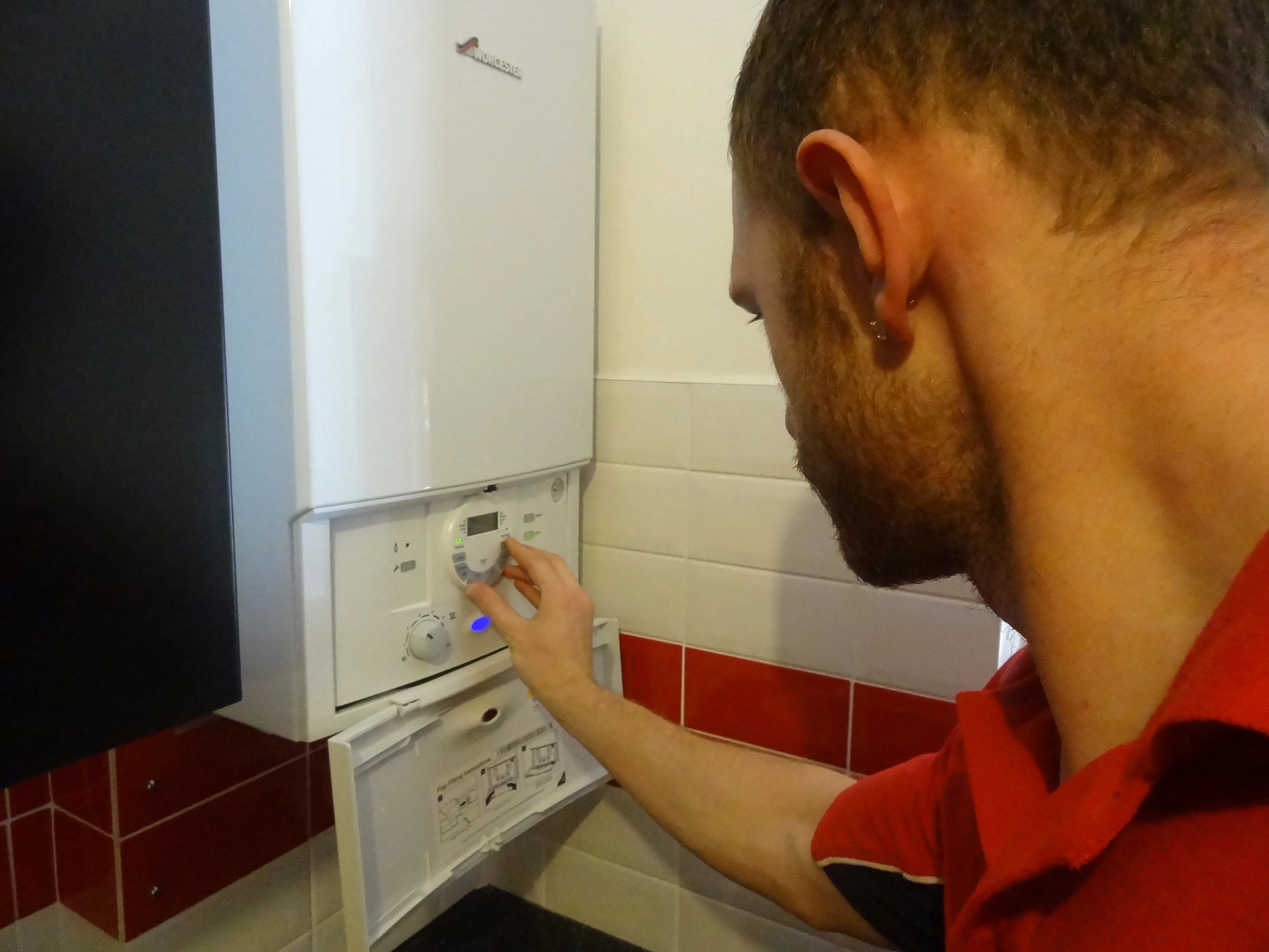 Loughton Plumbers engineer working on a boiler installation in Loughton